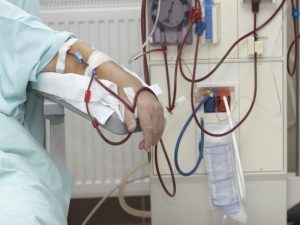 patient helped during dialysis session in hospital